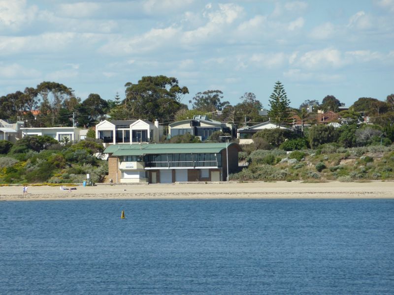 Hampton - Beach and coastline north of Hampton Lifesaving Club: View across bay towards Hampton Lifesaving Club