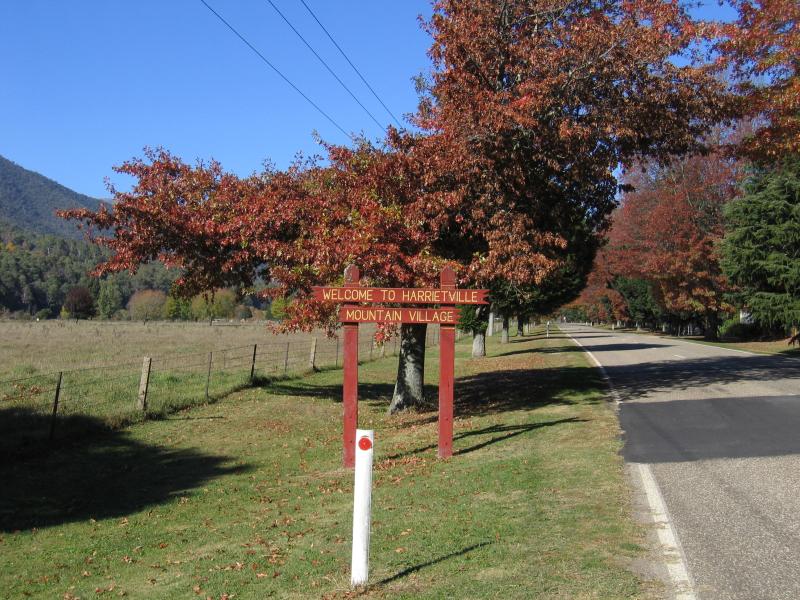 Harrietville - Northern outskirts of Harrietville: Welcome to Harrietville Mountain Village sign, Great Alpine Rd just south of Howards Bridge