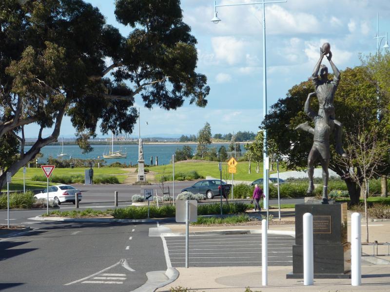Hastings - Commercial centre and shops, High Street precinct: View east along High St at John Coleman statue towards Marine Pde and foreshore