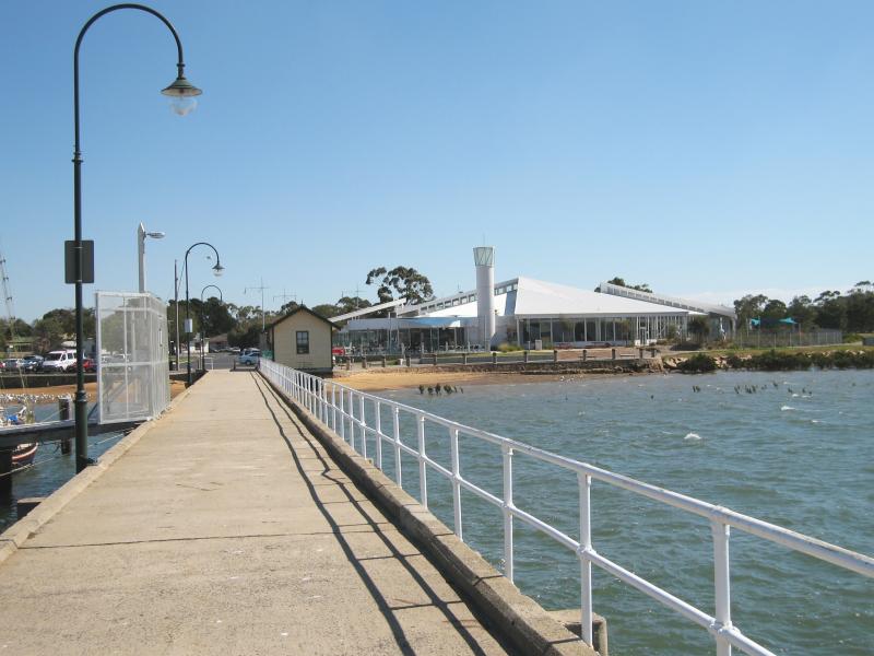 Hastings - Hastings Jetty and Pelican Park Recreation Centre: View along jetty back towards the shore and recreation centre