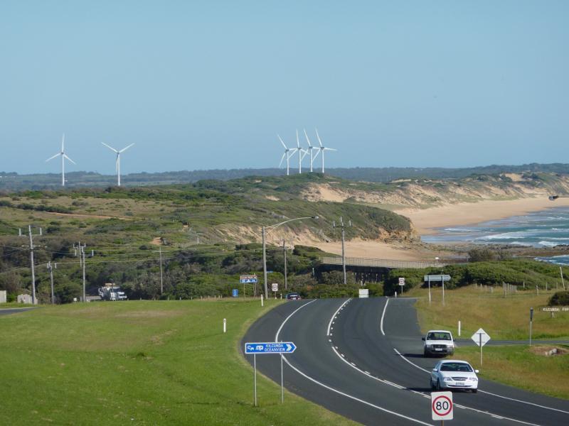 Kilcunda - Bass Highway south-east of town centre: View south-east along Bass Hwy towards Trestle Bridge and turbines at Wonthaggi Wind Farm