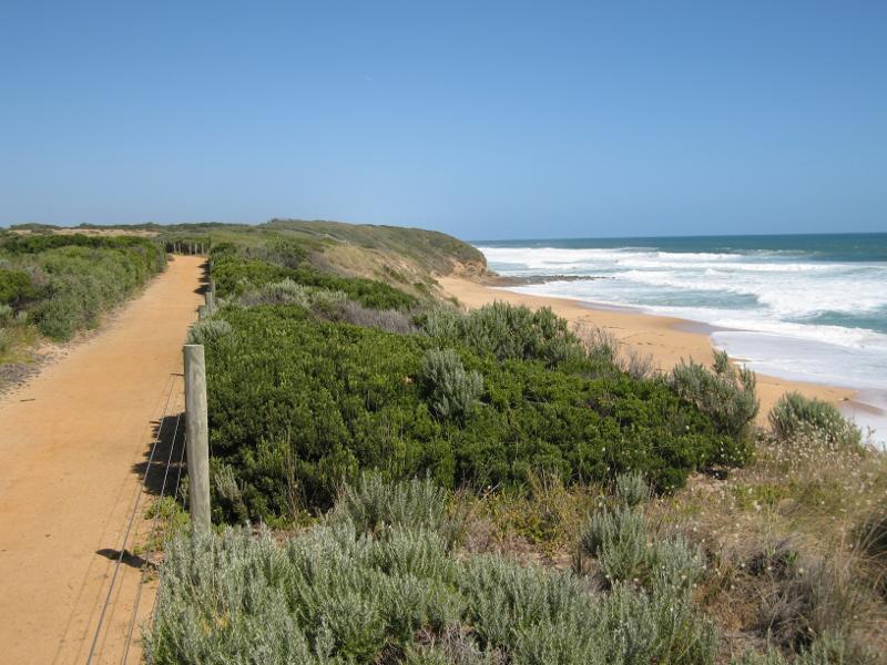 Kilcunda - Trestle Bridge and Bass Coast Rail Trail, Bass Highway around Bourne Creek: View south-east along rail trail overlooking beach, east of Trestle Bridge