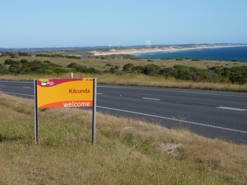 Kilcunda - Bass Highway north-west of town centre: Kilcunda town sign, view south-east along Bass Hwy, east of Mitchell Rise