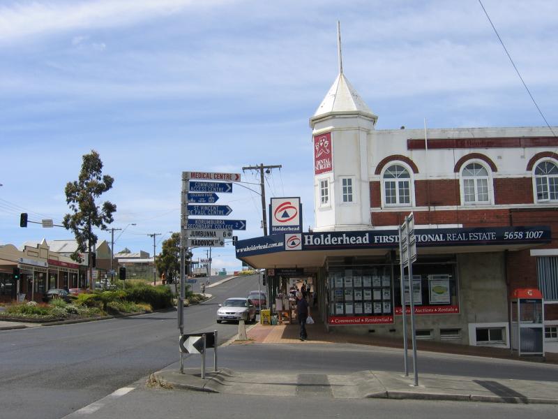 Korumburra - Commercial centre and shops, Commercial Road, Bridge Street and Mine Road: View south-east along Commercial St at Radovick St