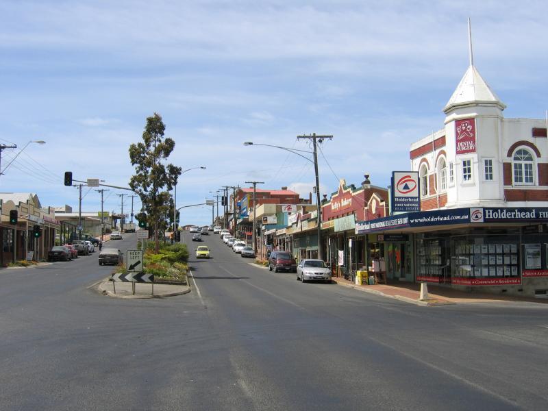 Korumburra - Commercial centre and shops, Commercial Road, Bridge Street and Mine Road - View south-east along Commercial St at Radovick St
