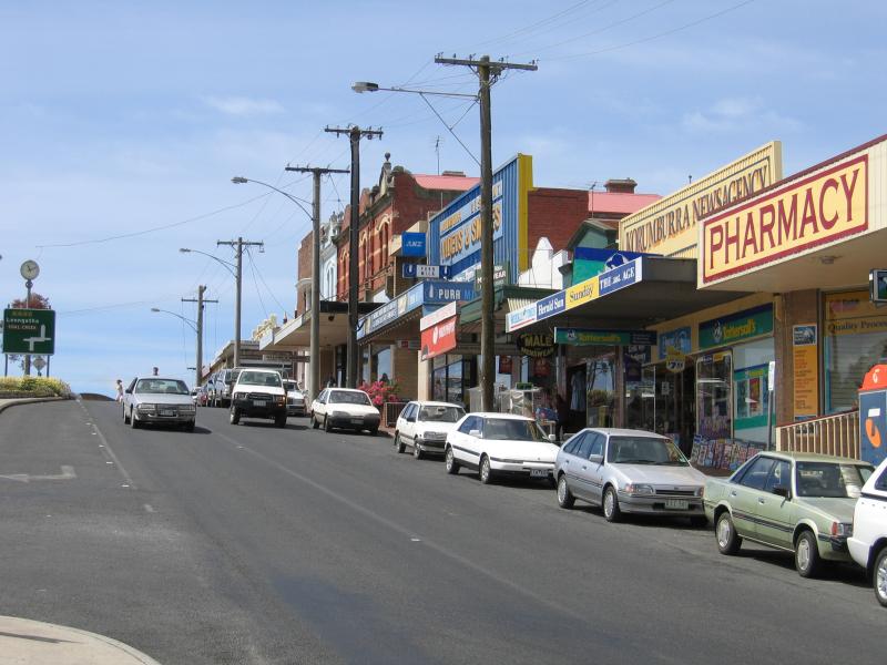 Korumburra - Commercial centre and shops, Commercial Road, Bridge Street and Mine Road: View south-east along Commercial St between Bridge St and Radovick St