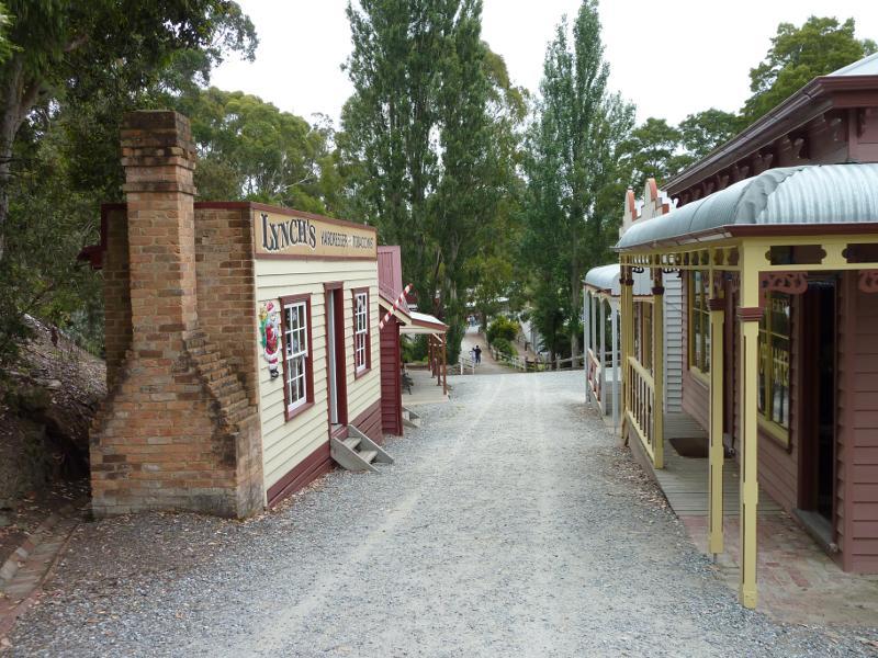 Korumburra - Coal Creek Heritage Village, Silkstone Road: View along Commercial Street towards barber shop and boot maker