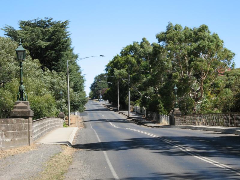 Kyneton - Campaspe River: View south along Mollison St at bluestone bridge over Campaspe River