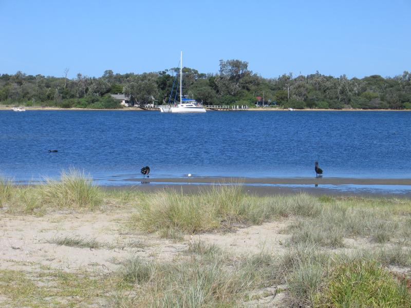 Lakes Entrance - Marinas, jetties and foreshore, Cunninghame Arm along Esplanade: View south across Cunninghame Arm between Carstairs Av and Laura St