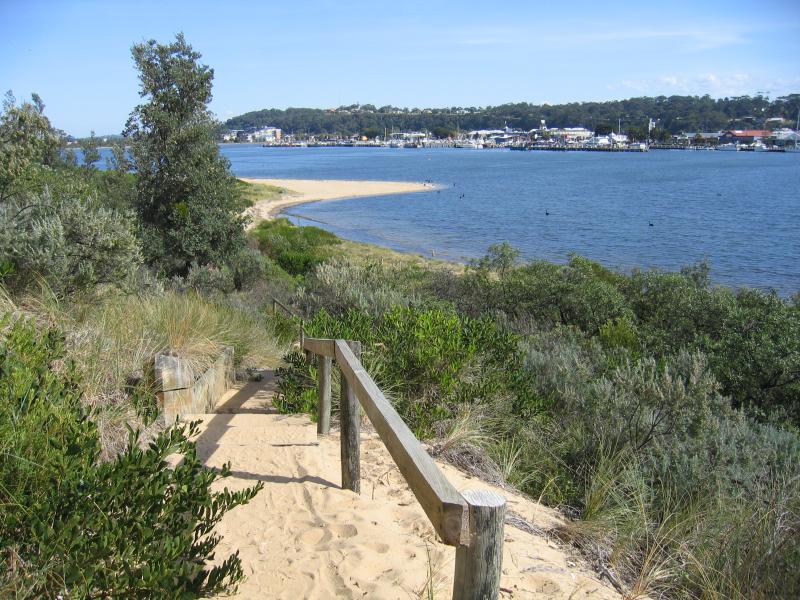 Lakes Entrance - Main Beach along Cunninghame Arm: View west along coast from lookout west of footbridge