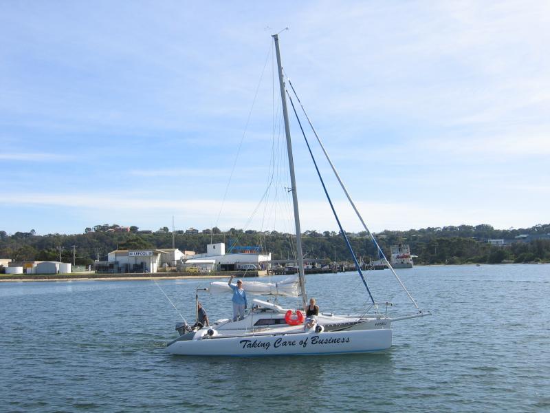 Lakes Entrance - Main Beach along Cunninghame Arm: The 'Taking Care of Business' yacht viewed from Flagstaff Jetty