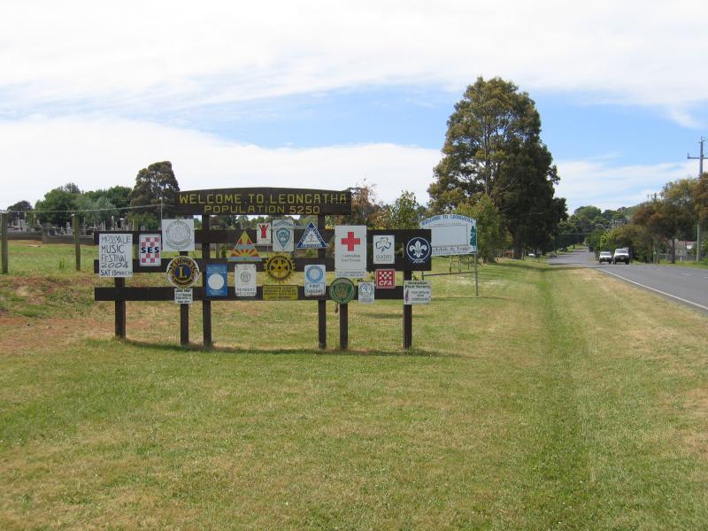 Leongatha - Around town: Welcome to Leongatha sign, view north along Bass Highway at cemetery