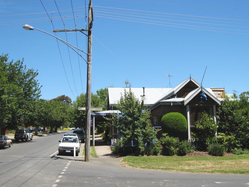 Macedon - Commercial centre and shops, Victoria Street: The Clock and Beaver bar & cafe, view west along Victoria St at Bruce St