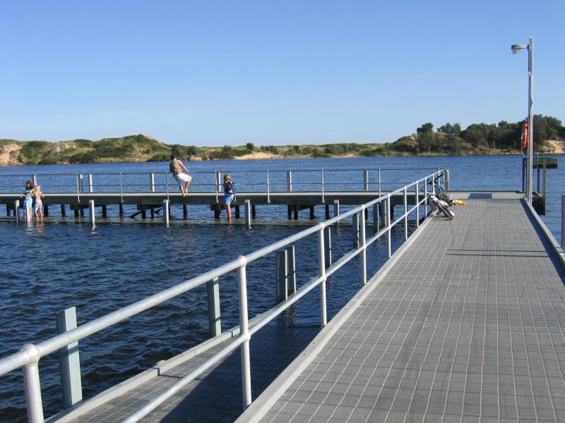 Marlo - Jetty, boat ramp and Foreshore Road: View along jetty and across Snowy River