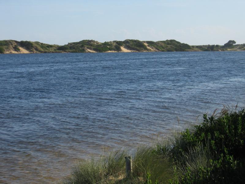 Marlo - Jetty, boat ramp and Foreshore Road: View west along Snowy River at eastern end of Foreshore Rd