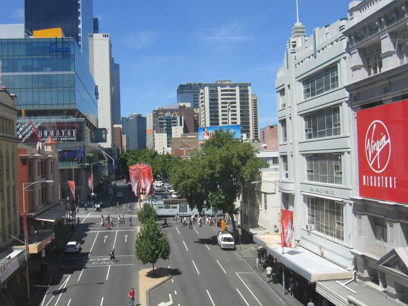 Melbourne CBD - Melbourne Central Shopping Centre and neighbouring department stores: View east along Lonsdale St towards Swanston St from walkway linking Melbourne Central with Myer