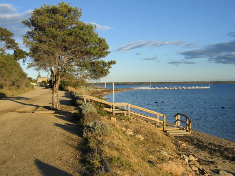 Metung - Beach and jetty, western end of Kurnai Avenue: View south-east along Beach Rd towards jetty