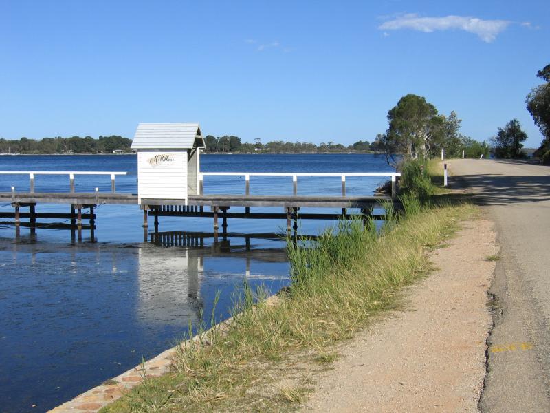 Metung - Metung Road, north of town centre: View south along coast towards jetty opposite McMillans Coastal Resort