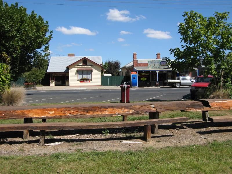 Mirboo North - Baromi Park, between Ridgway and Couper Street - Long picnic table, view south towards post office on Ridgway