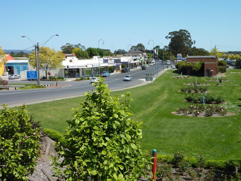 Moe - Lloyd Street near railway station: View west along Lloyd St and rose gardens at High St