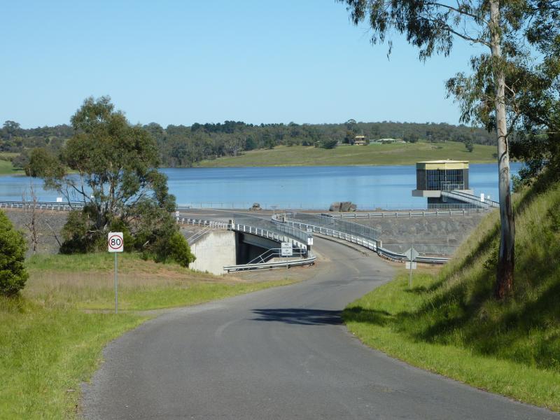 Moe - Blue Rock Lake embankment and spillway: View south-west along Spillway Rd towards spillway and embankment