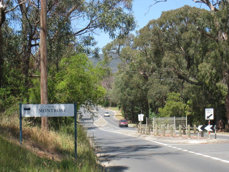 Montrose - Around Montrose: Montrose town sign, view south-east along Mt Dandenong Rd towards Bretby Way
