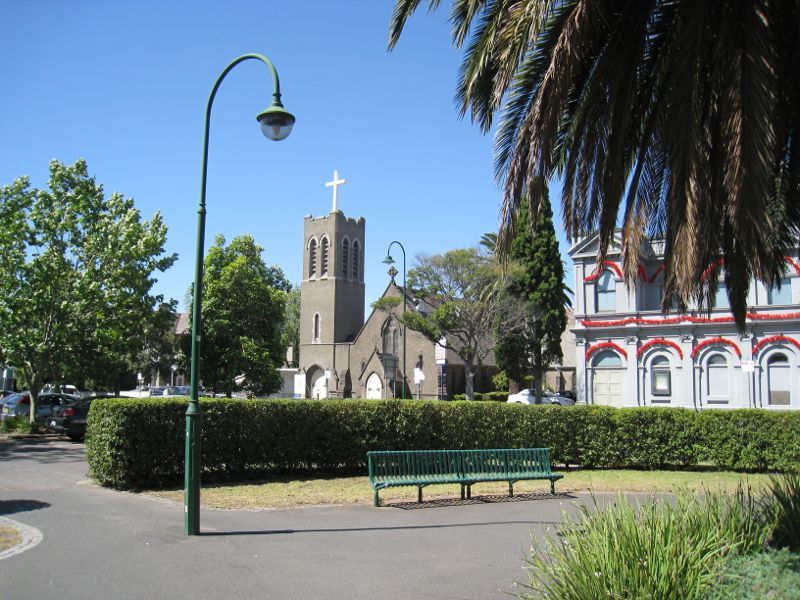 Moonee Ponds - Mount Alexander Road: View north from gardens in centre of Mt Alexander Rd towards St Thomas Anglican Church