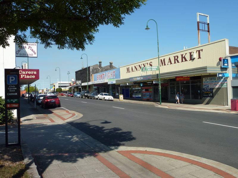 Morwell - Shops and commercial centre, Commercial Road, Tarwin Street and George Street: View east along Commercial Rd between Hazelwood Rd and Tarwin St towards Manny's Market