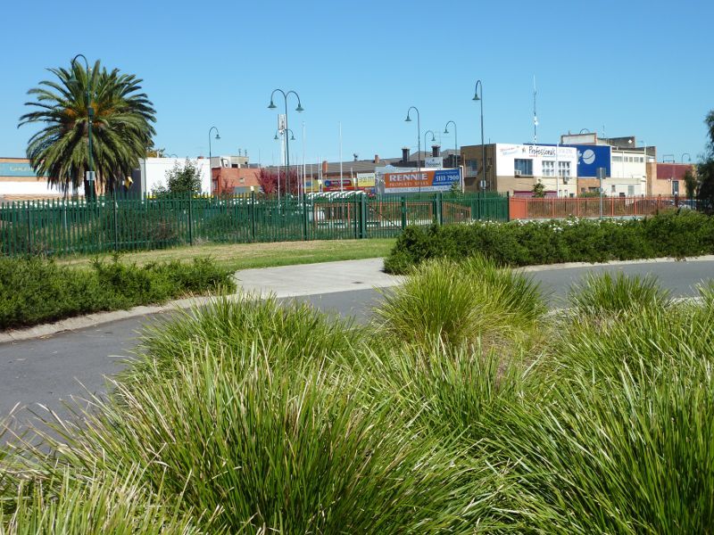Morwell - Morwell Railway Station and walkway under railway line, Princes Drive: View southwards towards shops along Commercial Rd from garden near walkway under railway line