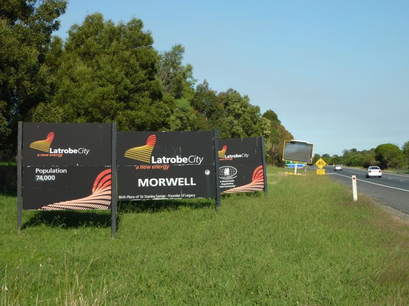 Morwell - Princes Freeway around Morwell: Latrobe City and Morwell signs, view east along Princes Fwy approaching Commercial Rd exit