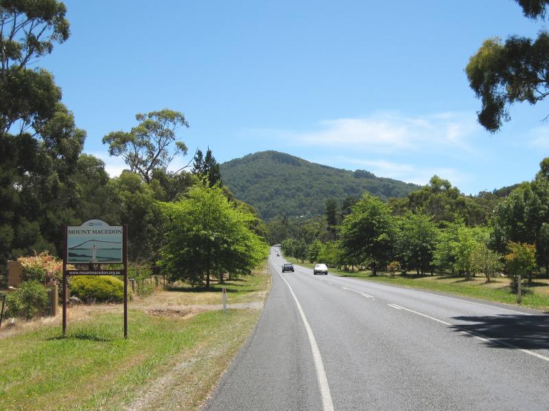 Mount Macedon - Mount Macedon Road: Mount Macedon town sign, view north along Mt Macedon Rd at Childers Rd