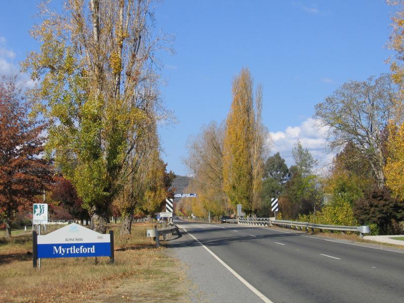 Myrtleford - Rotary Park, Great Alpine Road at Barwidgee Creek: View south-east along Great Alpine Rd towards Barwidgee Creek and Myrtleford town sign