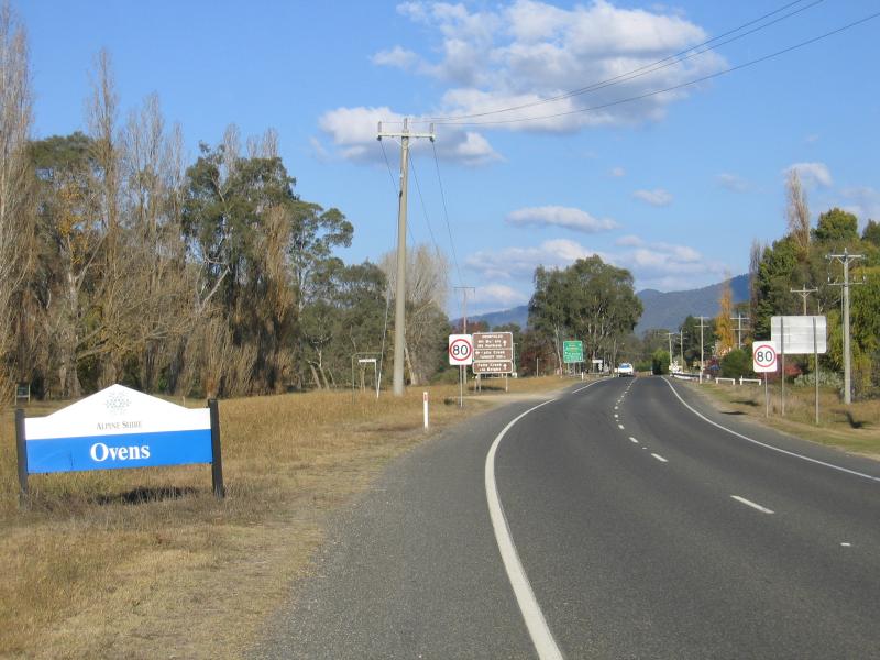 Myrtleford - Town of Ovens, 5 kilometres south-east of Myrtleford: View south-east along Great Alpine Rd towards Ovens town sign