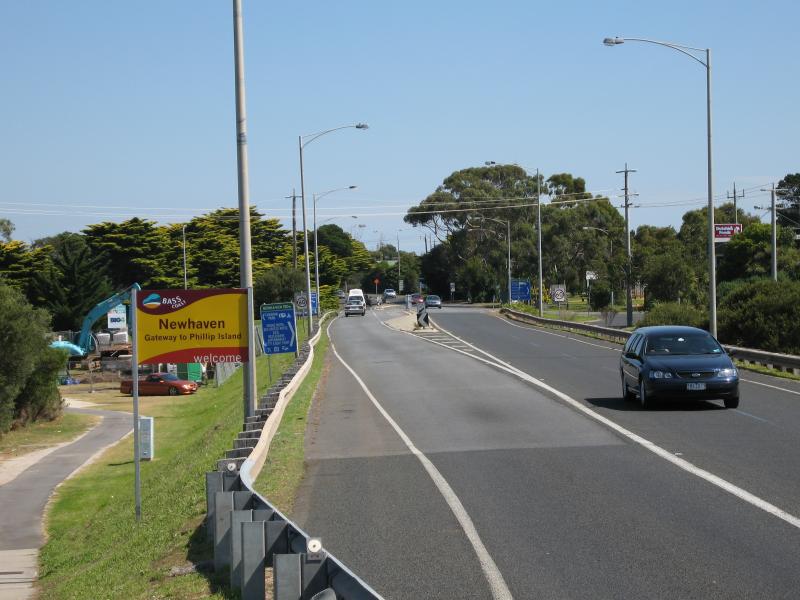 Newhaven - Phillip Island Road through Newhaven - View north-west along Phillip Island Rd towards town sign and Forrest Av