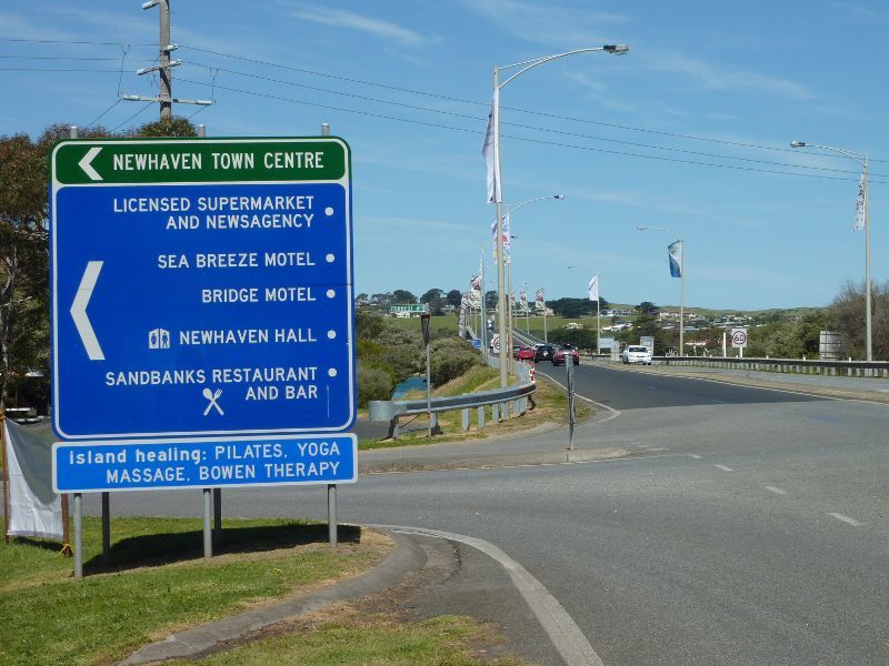 Newhaven - Phillip Island Road through Newhaven: View south-east along Phillip Island Rd at Forrest Av towards Phillip Island Bridge