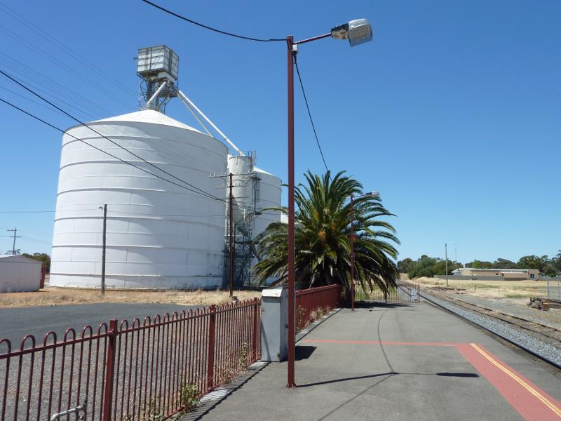 Nhill - Railway station, Whitehead Avenue: View east along railway platform towards silos