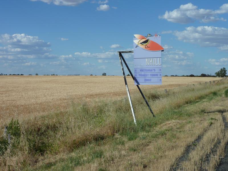 Nhill - Western Highway in Nhill, south-west of commercial centre: Nhill town sign, view north-east along Western Hwy south of Nhill-Harrow Rd