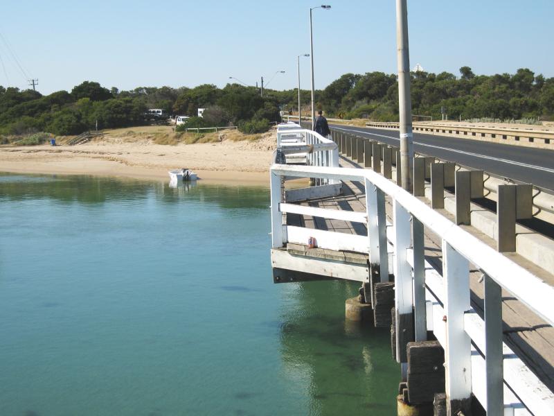 Ocean Grove - Coastline around Barwon Heads Bridge - View east along bridge towards beach and camping areas