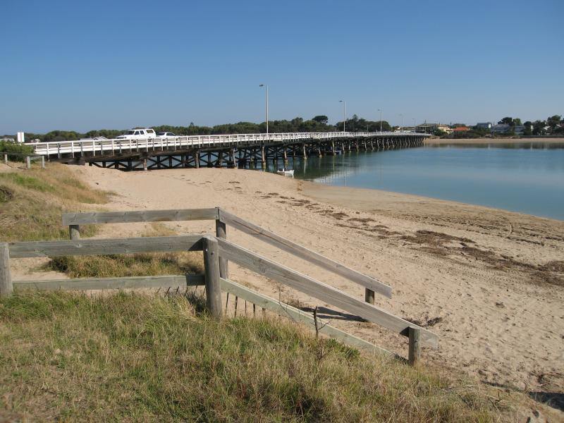 Ocean Grove - Coastline around Barwon Heads Bridge: View south along Barwon River towards bridge from beach