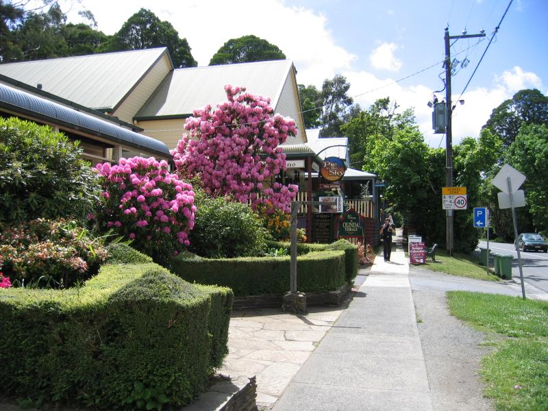 Olinda - Commercial centre and shops, Mt Dandenong Tourist Road at Monbulk Road: View east along Monbulk Rd