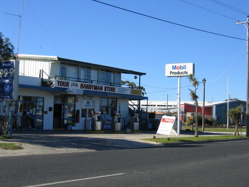 Paynesville - Commercial centre and shops: Service station and hardware, view east along Esplanade at Raymond St