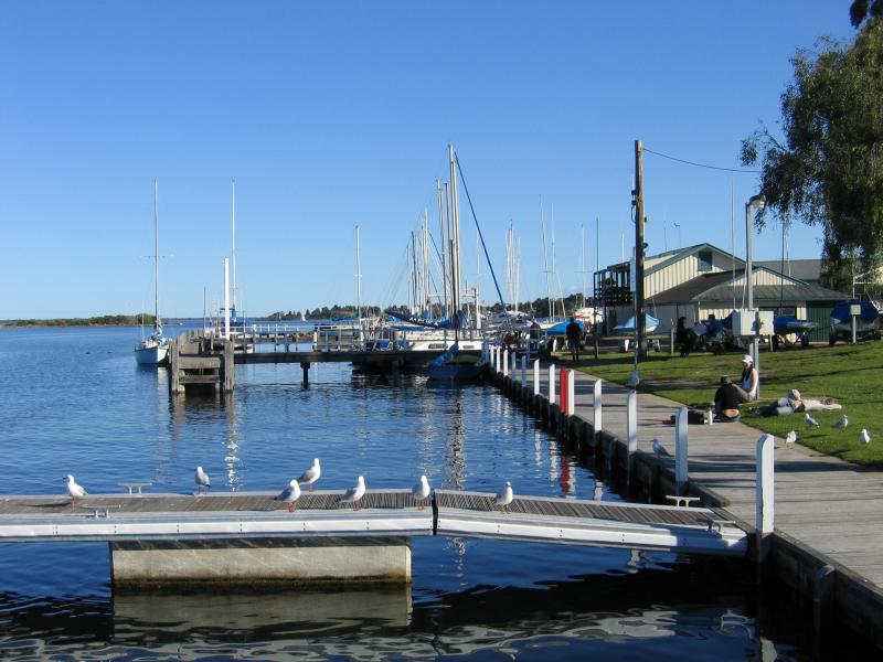 Paynesville - McMillans Strait foreshore: View south along coast towards marina at the point