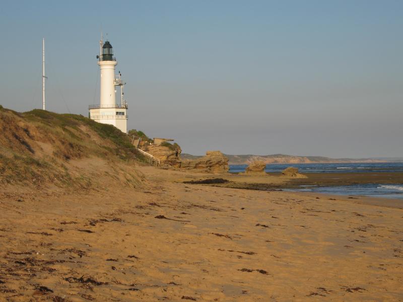 Point Lonsdale - Surf Back Beach at Stoneman Reserve, Ocean Road: View east along beach towards lighthouse