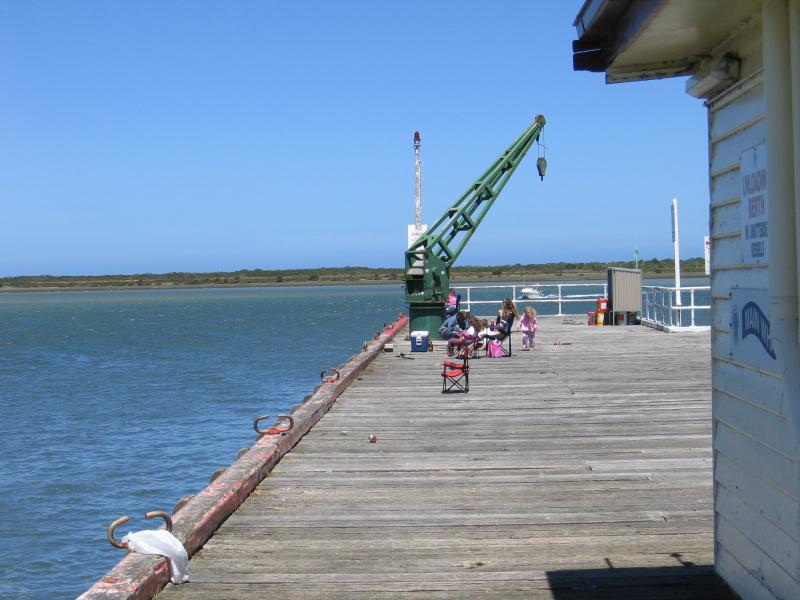 Port Albert - Wharf area, south-eastern end of Wharf Street: View south-east along Main Wharf from Port Albert Seafood shop