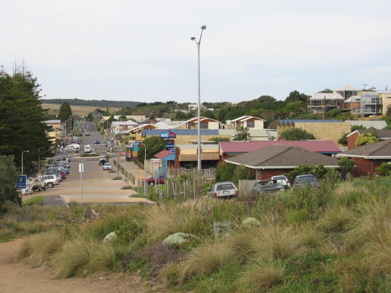 Port Campbell - Port Campbell Bay, jetty and beach: View north-east along Lord St towards jetty access road and Cairns St