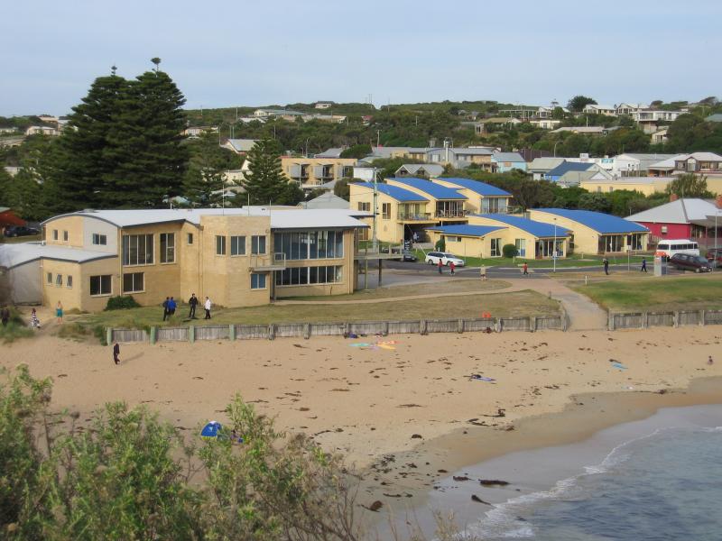Port Campbell - Discovery Walk and views over Port Campbell Bay: View of surf Life Saving Club and beach from steps up to Discovery Walk