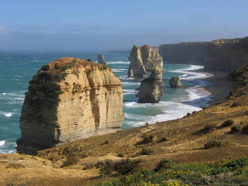 Port Campbell - 12 Apostles: View west along coast towards towards 12 Apostles from walking path along cliff top