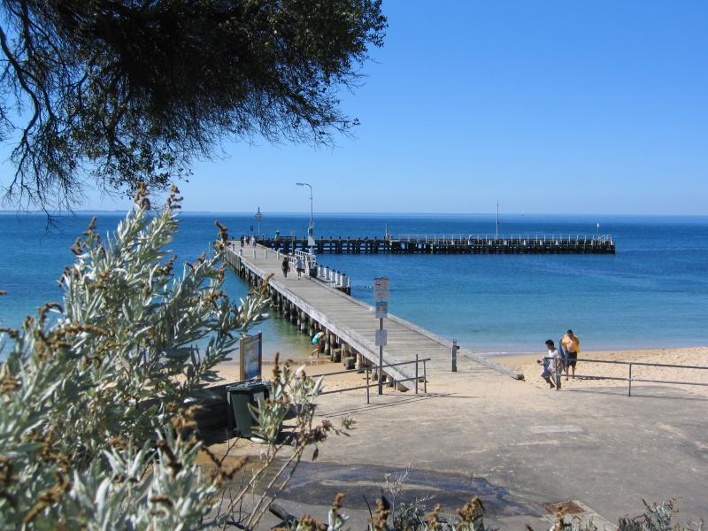 Portsea - Portsea Pier and foreshore at Weeroona Bay: View to pier and beach from W.E. Newton Reserve