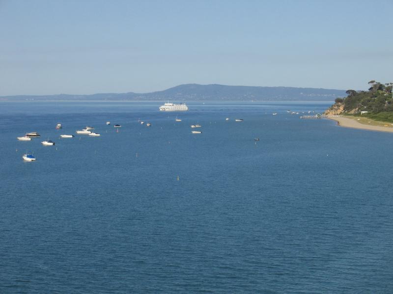 Portsea - Point Franklin: View east along coast towards Point McArthur with Arthurs Seat in the background