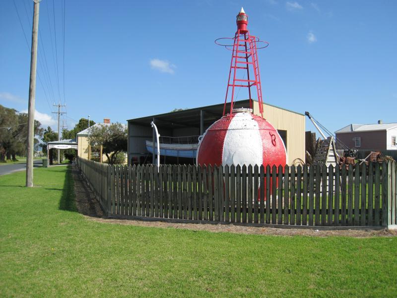 Port Welshpool - Maritime Museum, corner Turnbull Street and Townsend Street: Navigational buoy and Janet Iles fishing boat in shed behind